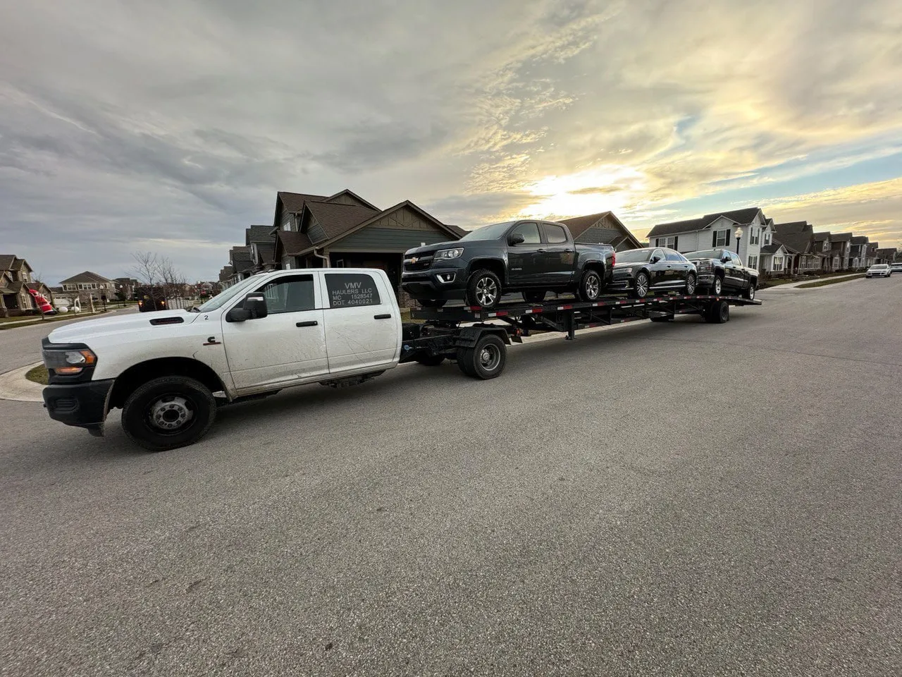 Open car hauler trailer loaded with vehicles